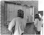 University Center - Student Looking at Bulletin Board C. 1970s 2883 by University of Missouri-St. Louis and Art Witman