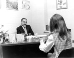 Administration of Justice Professor with Student, C. 1970s (Original Print in MU Archives in Columbia) 4927 by University of Missouri-St. Louis